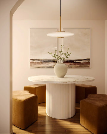 Kuzco Pendant Lighting hanging in a modern double-height living room, providing vertical accent lighting above a contemporary seating area | Ocean Pacific Lighting