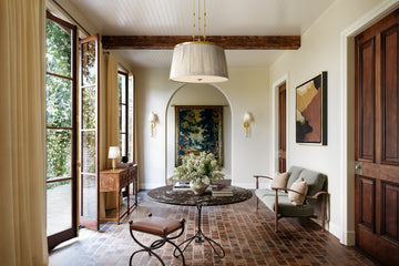 Modern pendant lighting in entryway creating a warm and refined first impression